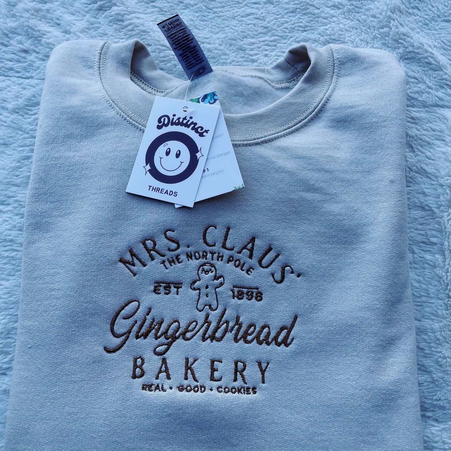 Mrs. Claus' Gingerbread Bakery Christmas Embroidered Crewneck Sweatshirt